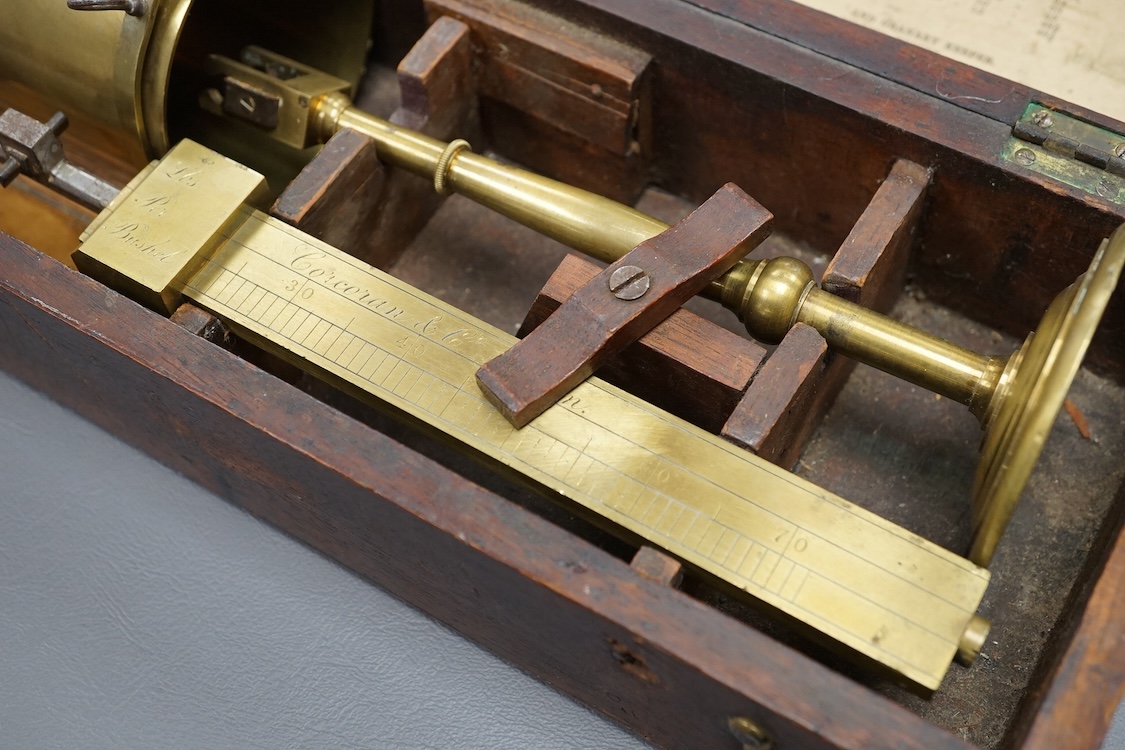 A 19th century mahogany cased brass Corn Balance, made by Bryan Corcoran & Co., 36, Mark Lane, London, with engraved scale and sliding balance marked with; ‘Lbs Per Bushel’, in its original fitted case with paper label t